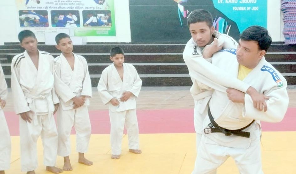 Players learning the tricks of Judo at Ambedkar Sports Stadium