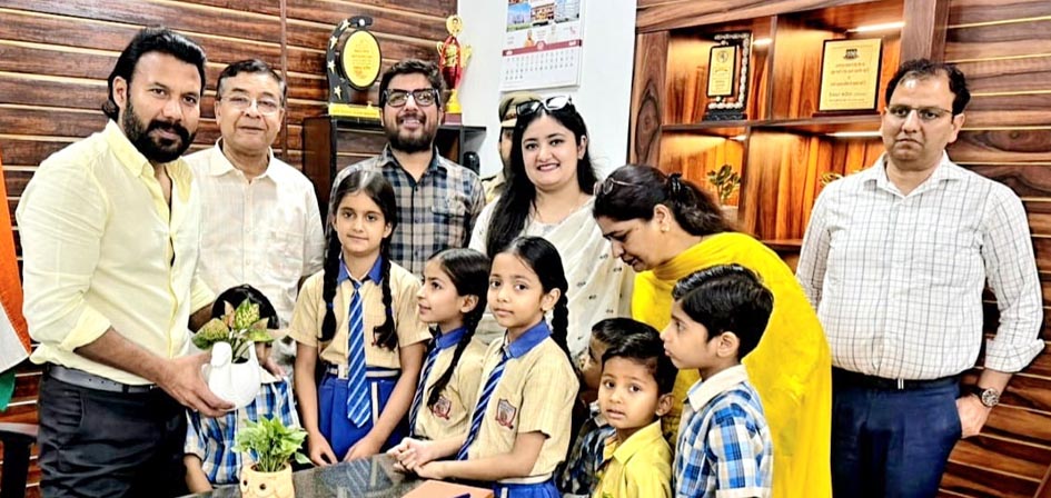 Children presented saplings to the DM on World Earth Day