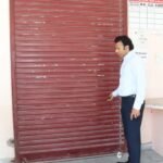 The District Election Officer inspected the sealed warehouse.
