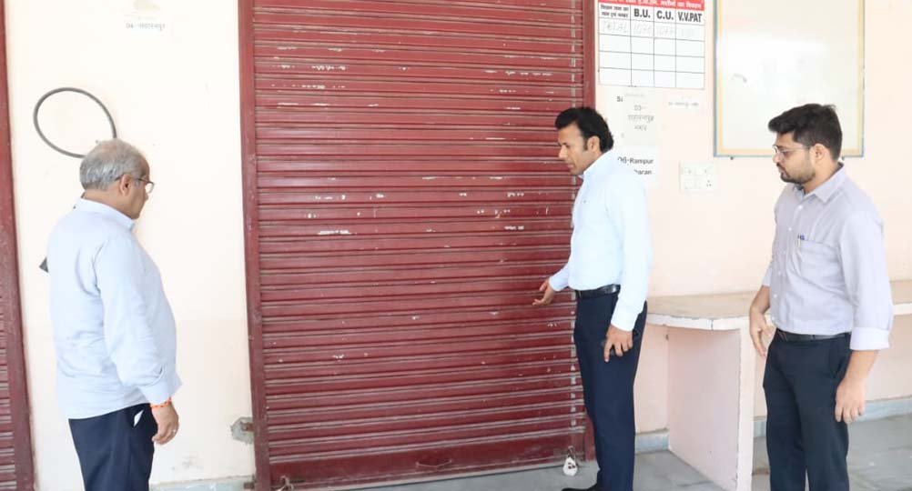 The District Election Officer inspected the sealed warehouse.